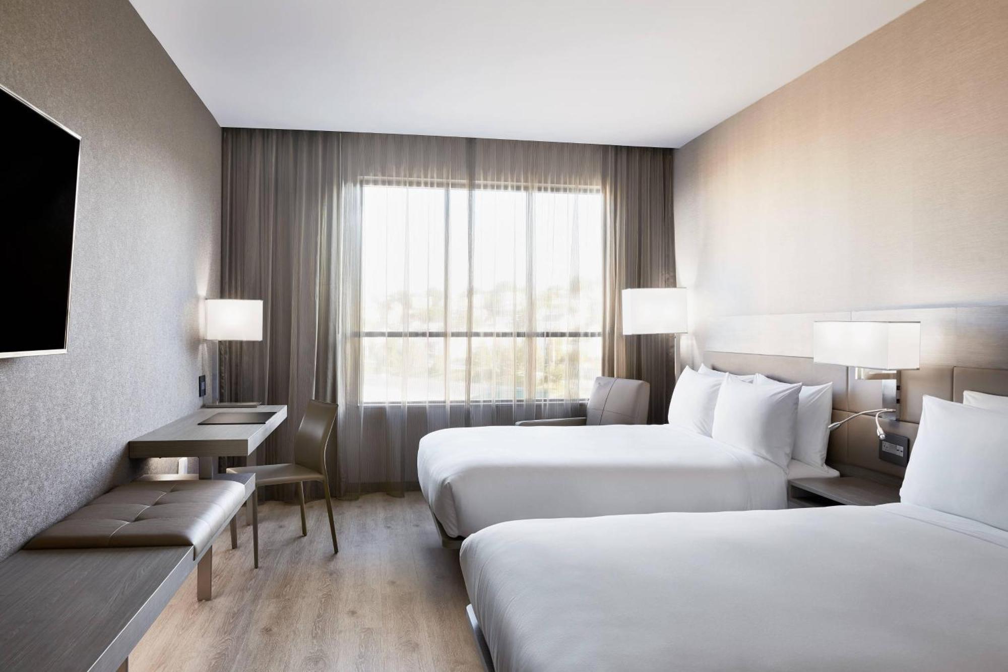 Queen Room with Two Queen Beds and Partial Water View - Hearing Accessible